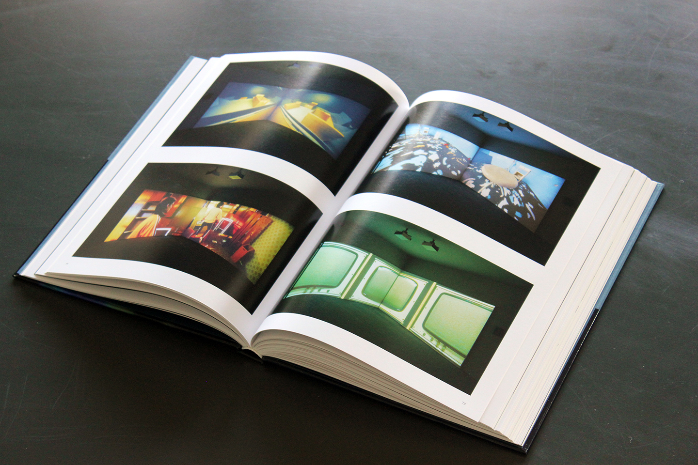 Interior spread of The Human Condition, showing installation views from Jane and Louise Wilson's Stasi City
